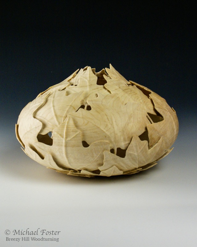 Fibonacci Maple-    A vessel carved with 5 spirals of maple leaves in one direction and 3 in the other----SOLD