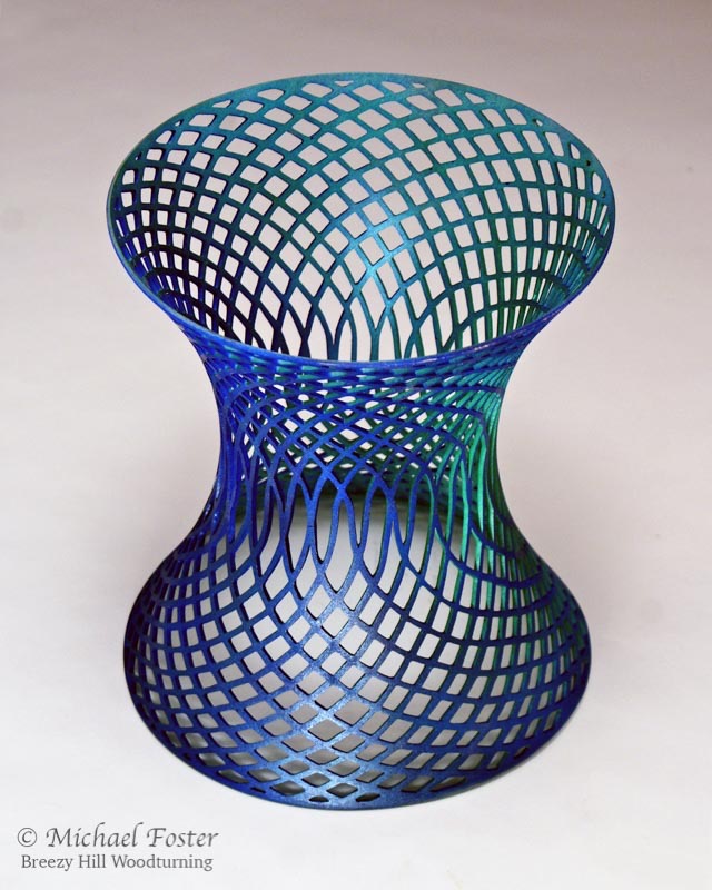 Parastichy-  A catenoid minimal surface (one of the simplest) pierced with 2 opposing spirals, 21 in one direction and 34 in the other.  These are numbers that are part of the Fibonacci series.----AVAILABLE