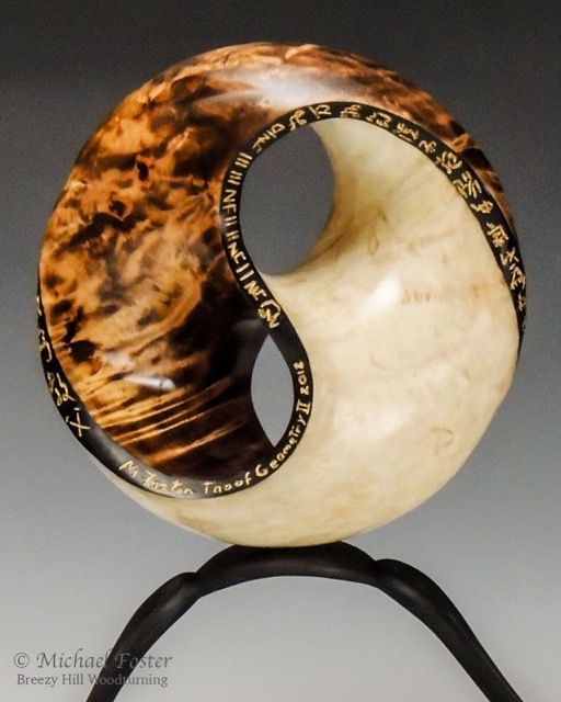 Tao of Geometry II-   Form- Elder Burl, Aniline dye, bleach, acrylics, Bush oil 8&rdquo;D x 3&rdquo;deep.  Stand is maple comp wood, ebonized with india ink 14&rdquo;W x 4&rdquo;H.  Slate base----SOLD