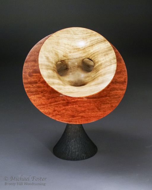 Costa Hoffman Meeks-   A very intriguing form.  There are only 2 sides to the form shown by the different colors as a result of the tunnels that join the surfaces.----SOLD