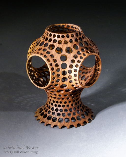 Schwarz&rsquo;s Cat-   A minimal surface that joins 6 circles centered on the faces of a cube with a catenoid base.  Walnut, Tung oil/varnish mix, 6.25