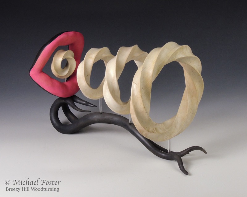 Blowing Smoke-   A piece constructed of 4 different torus knot forms and a sculpted mouth and base----AVAILABLE