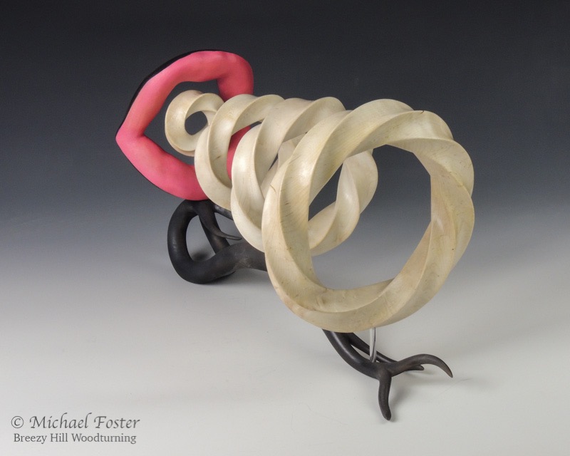 Blowing Smoke-   Torus knots- blister maple, bleach, lacquer<br>Lips and base- maple, acrylics-----AVAILABLE